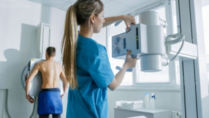 In the Hospital, Man Standing Face Against the Wall While Medica